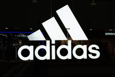 Adidas store in Galeria Shopping Mall in Saint Petersburg, Russia. Adidas is a multinational corporation, founded and headquartered in Herzogenaurach, Germany, clipart