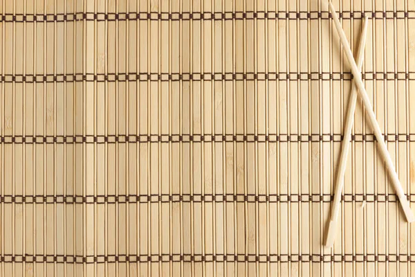 bamboo Mat for sushi with wooden chopsticks