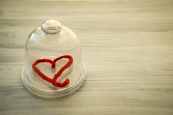 Valentine's day background with the heart under glass cup for a — Stock Photo, Image