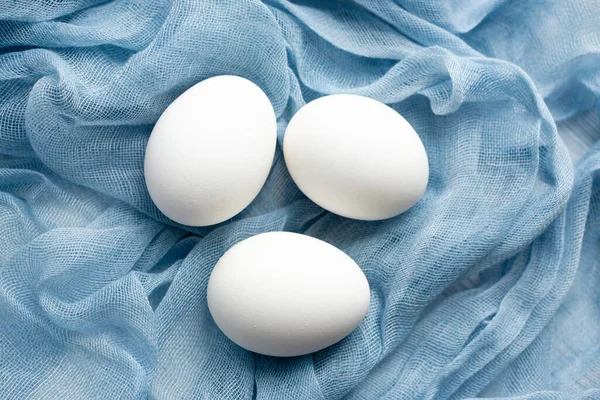 Three White Raw Boiled Eggs Blue Delicate Textile Gauze Soft — Stock Photo, Image