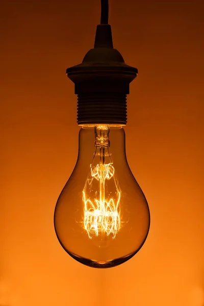 Lighted vintage incandescent bulb — Stock Photo, Image