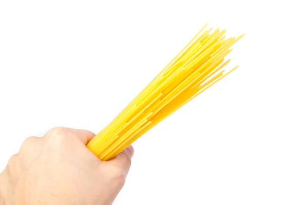 Spaghetti étant tenu dans une main — Photo