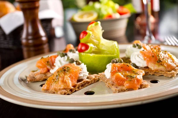 Fresh raw salmon canape with cream cheese — Stock Photo, Image