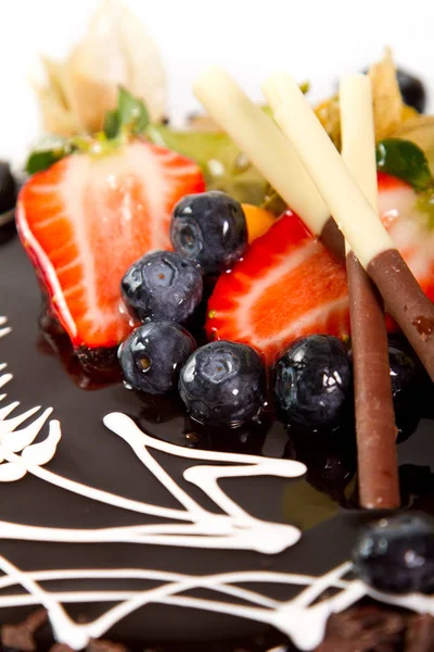 Fruit detail on a chocolate cake — Stock Photo, Image