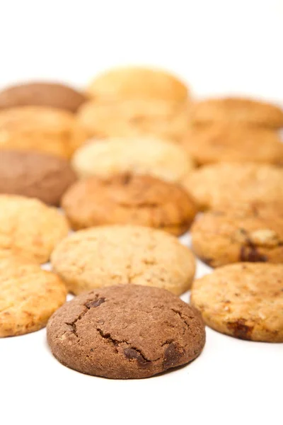 Diversi tipi di biscotti con uno al cioccolato a fuoco — Foto Stock