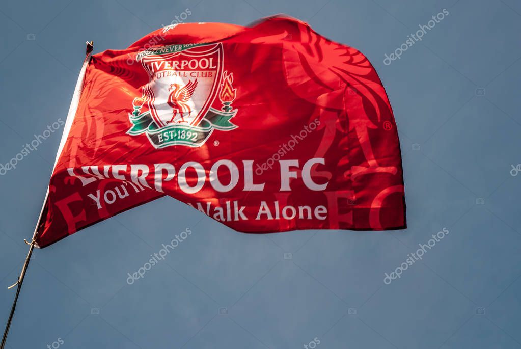 Liverpool - England - April 13, 2019: Liverpool F.C. Flag waving with the blue sky background.