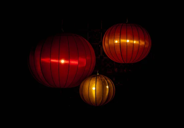 Chinese lantern & light bulb on dark background. The interior asian decorations.