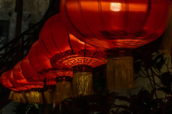 Chinese lantern & light bulb on dark background. The interior asian decorations. Selective focus.