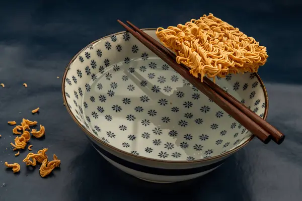 Easy food, Dried instant noodles and hot water in a bowl.
