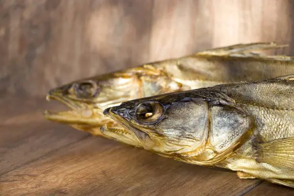 Smoked predatory fish. Zander. Cold smoked. Natural rustic background. — Stock Photo, Image