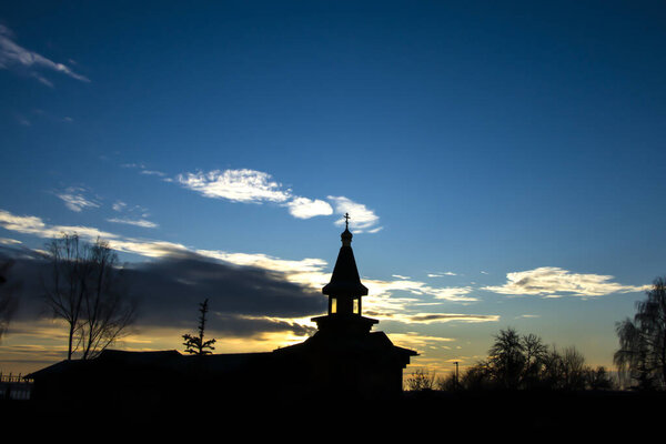 Orthodox wooden church at dawn. Temple of the Blessed Matrona of Moscow Soligorsk