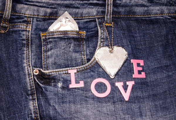 Valentines card. Jeans and what fits in your pockets. Relationship between people. Soft background. The concept of romance. — Stock Photo, Image