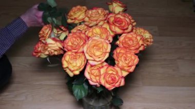 A wonderful bouquet of orange roses for your loved one. Romantic evening. Surprise for a loved one. Love and romance.