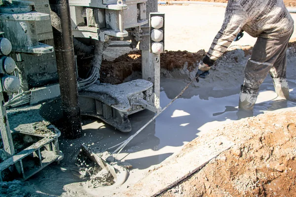 Drilling rig. Drilling mud preparation. Worker stirs the solution. Geology. Belarus. Salihorsk 2020