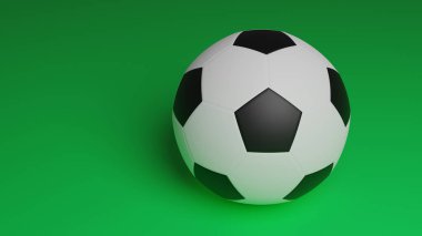 Yeşil arkaplanda izole edilmiş bir futbol topu, spor arkaplanı için fotokopi alanı olan futbol topunu kapat
