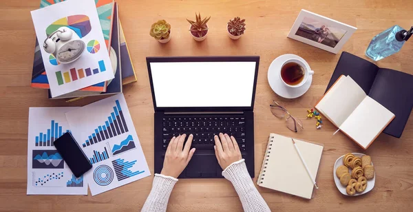 work from home. people typing on keyboard, working on laptop computer with blank white screen copy space during self isolation to avoid spreading illness transmission of COVID-19 Coronavirus outbreak.