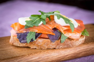 Bruschetta with tomato and basil, bruscetta with salmon and eggs, bruscetta with prosceutto and rucola