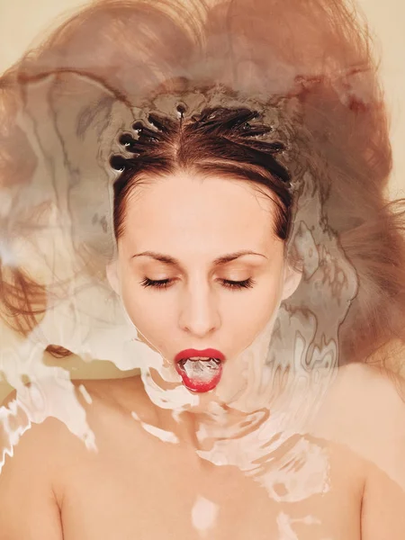 Fashion portrait of sensual woman in water — Stock Photo, Image
