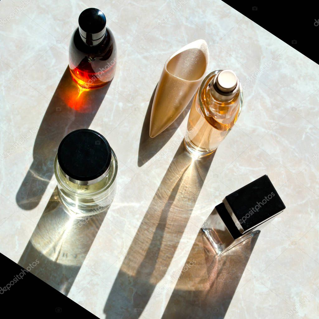 perfume bottles with long shadows