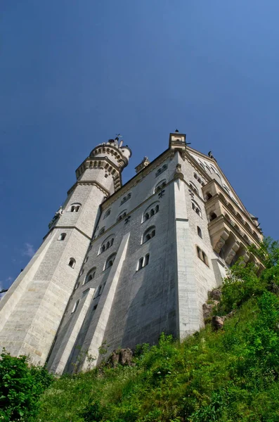 Fussen, Germany - June 29, 2019: Neuschwanstein Castle shrouded in mist in the Bavarian Alps. — Stock Photo, Image