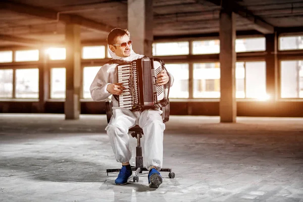 The musician playing the harmonica