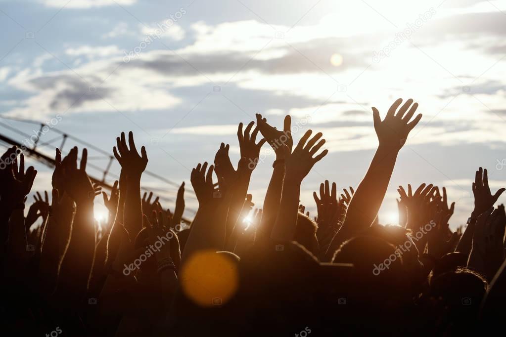 Silhouettes of hands at Outdoors Music Festival