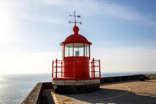 Red lighthouse lamp room on blue sky and sea background — Stock Photo, Image