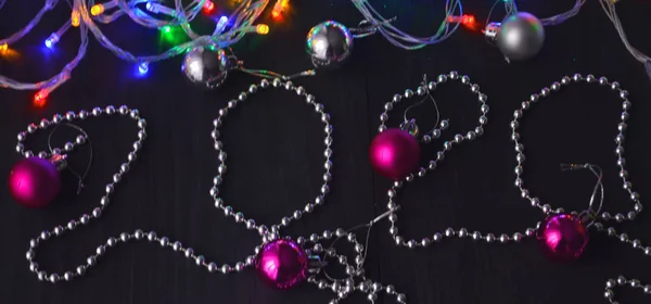 2020 with traditional New Year\'s balls and bright garlands on New Year\'s Eve