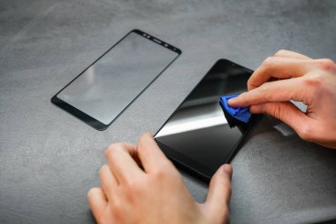 replacement of broken glass with a new one. Broken smartphone display. Broken glass phone. Smartphone Repair