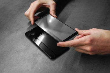 replacement of broken glass with a new one. Broken smartphone display. Broken glass phone. Smartphone Repair