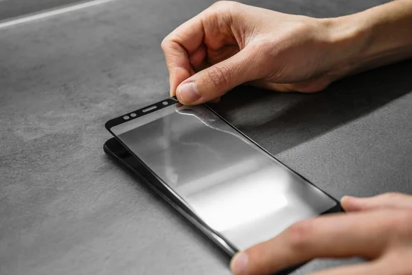 replacement of broken glass with a new one. Broken smartphone display. Broken glass phone. Smartphone Repair