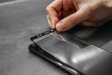 replacing broken glass with a new one. Broken smartphone display. Broken glass phone. Smartphone repair