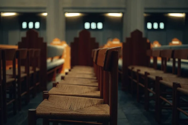 empty wooden chairs in a row in a church