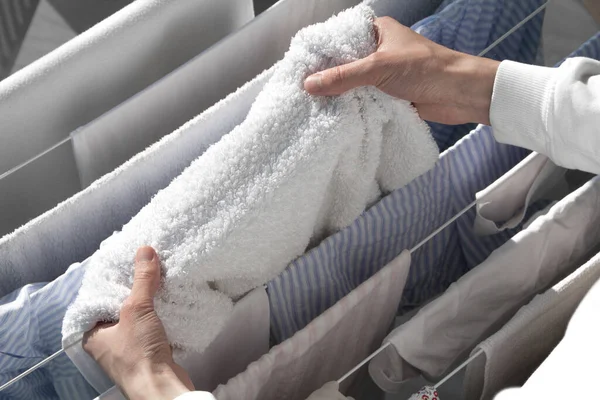 Man Hangs Towel Dryer Hands Holding White Towel Washed Clothes — Stock Photo, Image