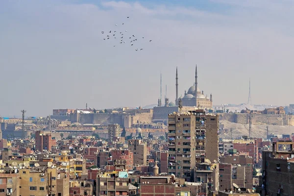 Aerial cityscape view of old Cairo, Egypt with old buildings and Citadel of Egypt in far distance — Stock Photo, Image