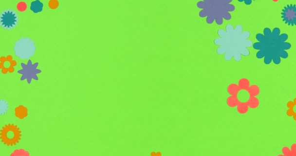 Un stop motion animé. Papier fleurs scrapbooking cadre formation sur un fond coloré .