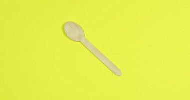 Stop motion Disposable appliance background for a meal of wood. Eco concept.