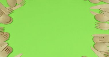 Stop motion Disposable appliance background for a meal of wood. Eco concept.