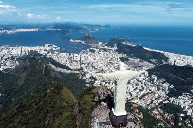 Aerial view of Redeemer Christ in the Rio de Janeiro, Brazil. Great landscape. Famous wonderful city. Travel destination. Tropical travel. Vacation destination. clipart