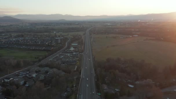 Aerial Shot Moving Along a Highway with Little Traffic and Mountains in the Back — Stock Video