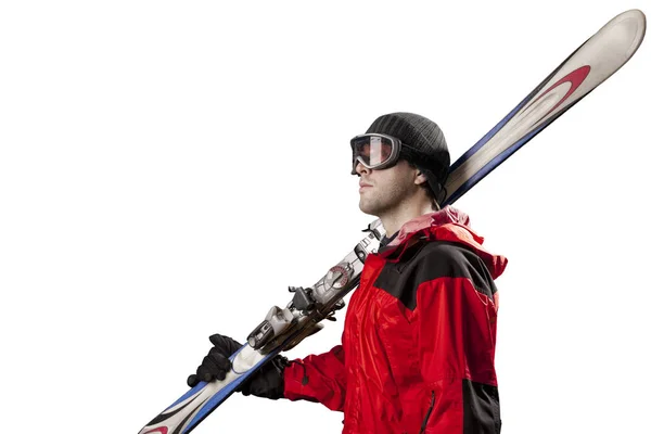 Skier holding a pair of skis — Stock Photo, Image