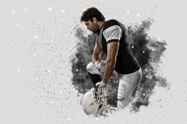 Football Player coming out of a blast of smoke — Stock Photo, Image