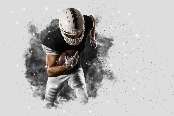 Football Player coming out of a blast of smoke — Stock Photo, Image