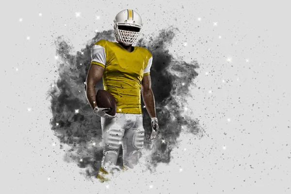 Football Player coming out of a blast of smoke — Stock Photo, Image