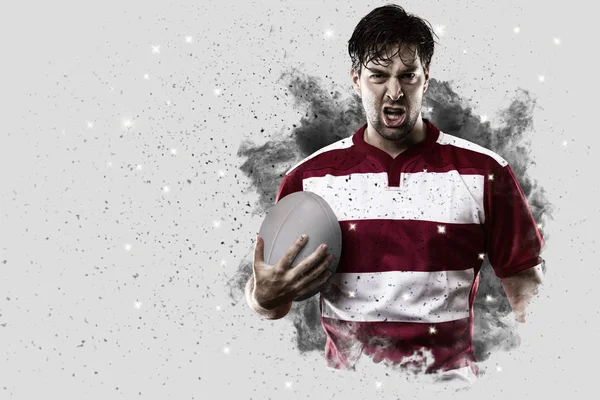 Rugby player coming out of a blast of smoke. — Stock Photo, Image