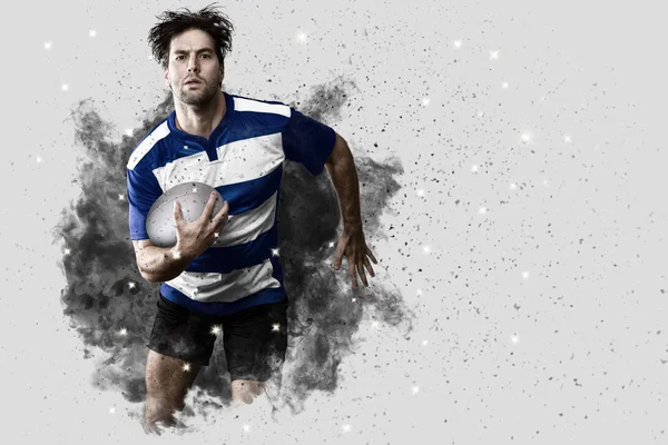 Rugbyspelare som kommer ur en tryckvåg av rök. — Stockfoto