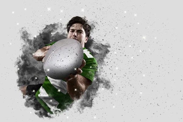 Rugby player coming out of a blast of smoke. — Stock Photo, Image
