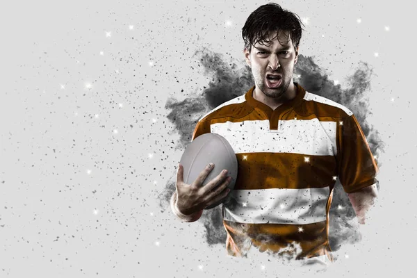 Rugby player coming out of a blast of smoke. — Stock Photo, Image