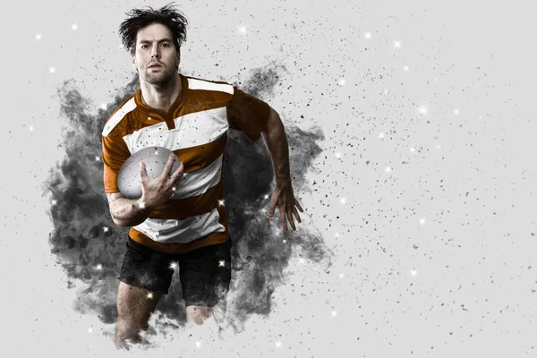 Gracz rugby, wychodzi z blast dymu. — Zdjęcie stockowe