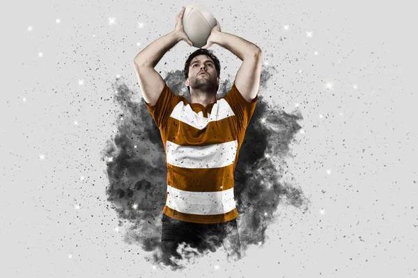 Rugbyspeler coming out van een explosie van rook. — Stockfoto